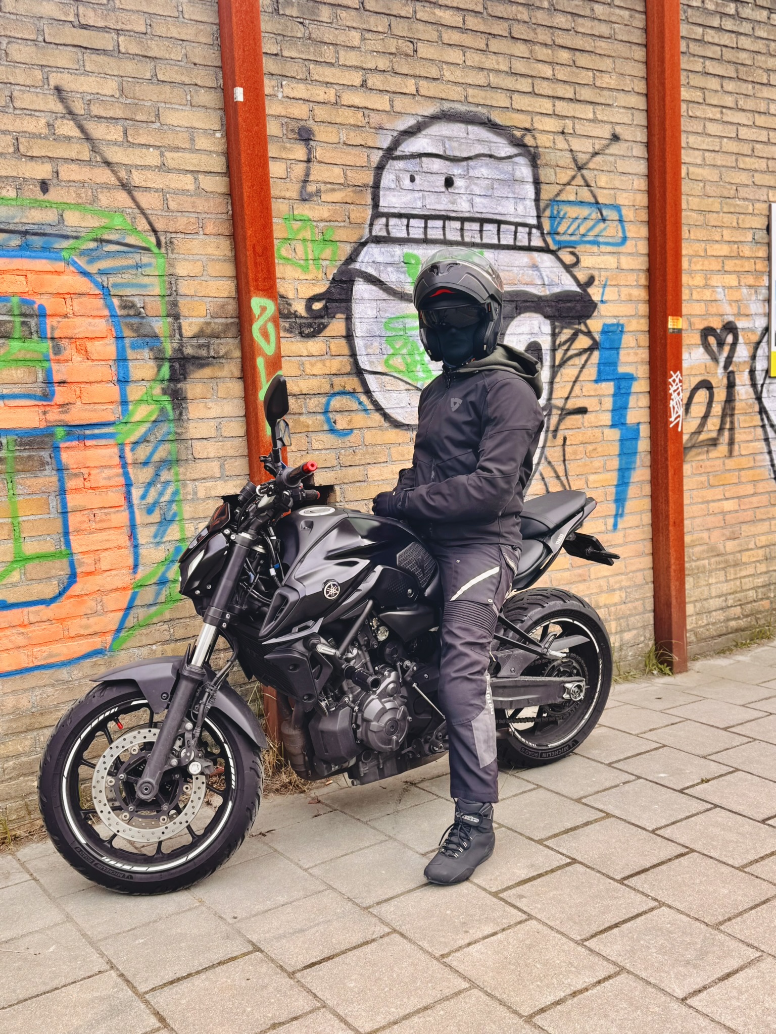Essential motorcycle safety gear including helmet gloves jacket pants and boots