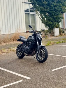 Black Yamaha MT-07 parked in an empty lot for braking practice