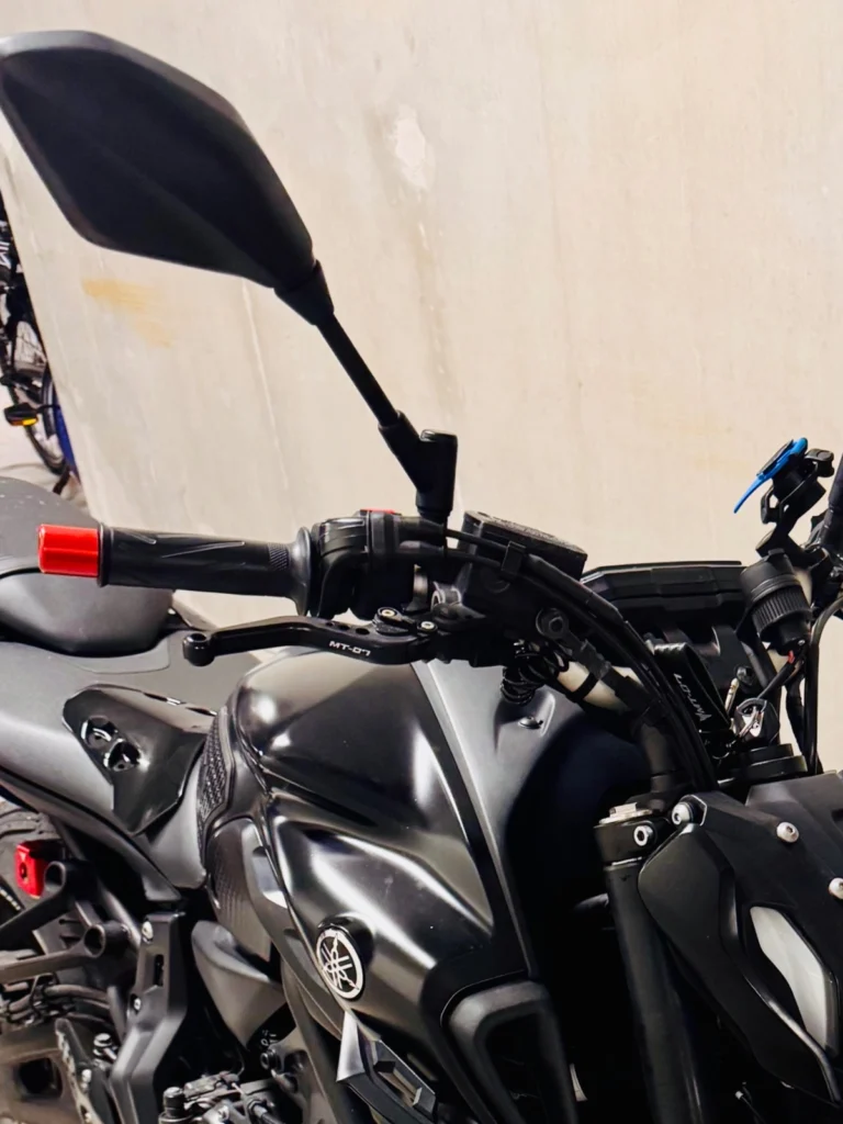 Close-up view of motorcycle front brake lever and controls