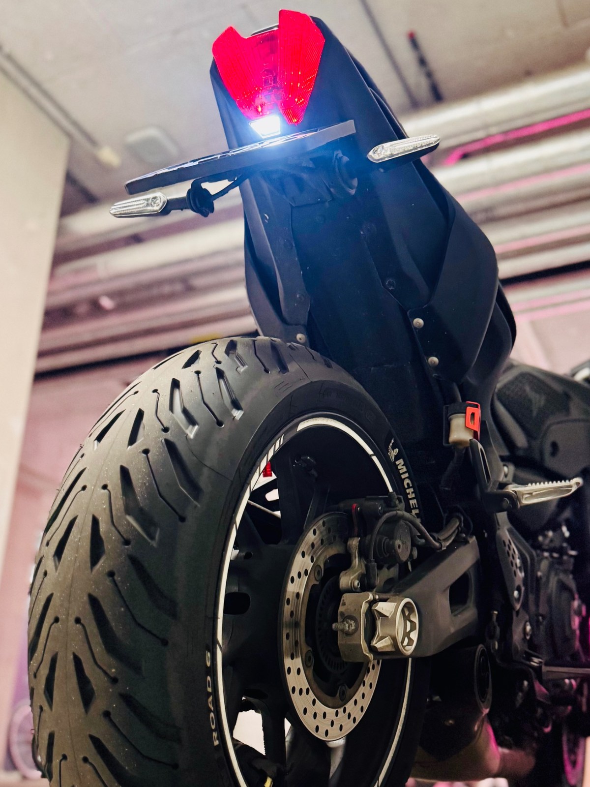 Close-up of Yamaha MT-07 rear tyre, brake disc and tail light