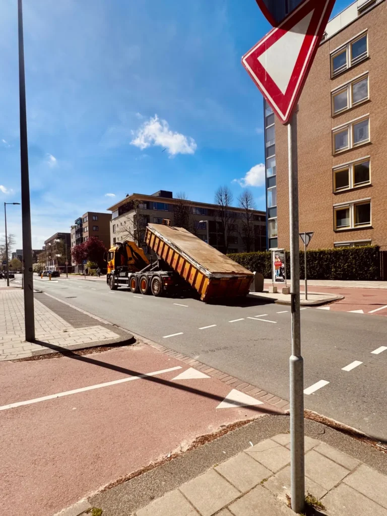 Heavy vehicle on an urban road, useful for motorcycle lane positioning around large traffic