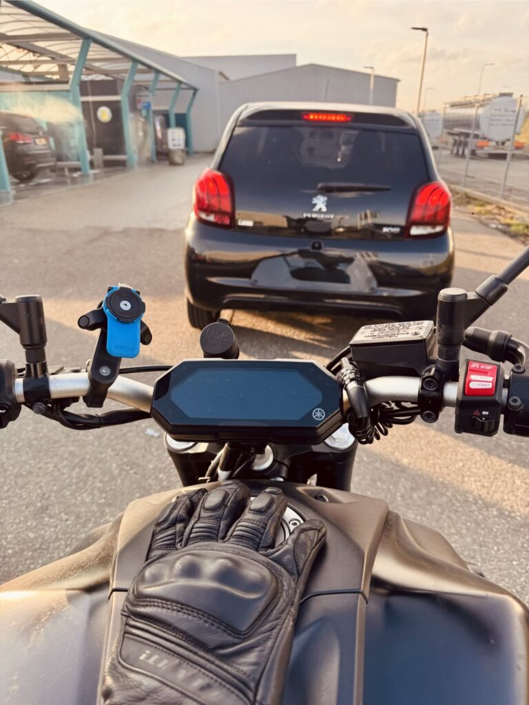 Car bumper showing why riders should look at the safe path instead of the hazard