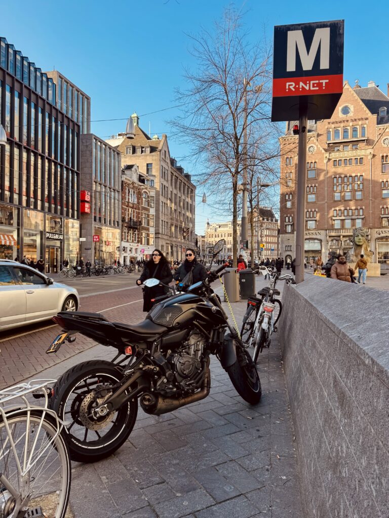 City traffic with pedestrians, cyclists and cars showing why motorcyclists need extra awareness