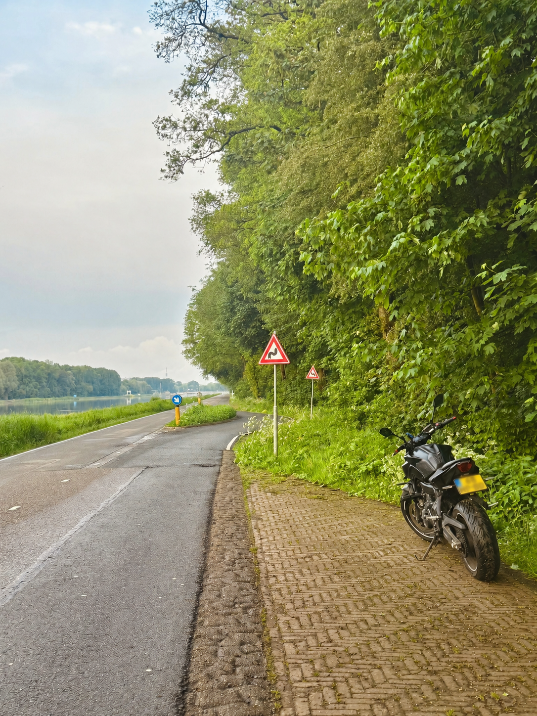 Road sign warning of a curve ahead for safe motorcycle cornering
