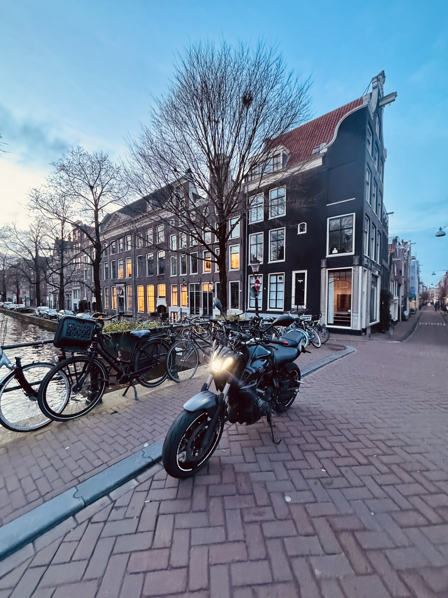 motorcycle parked near amsterdam canal showing vision techniques in urban riding