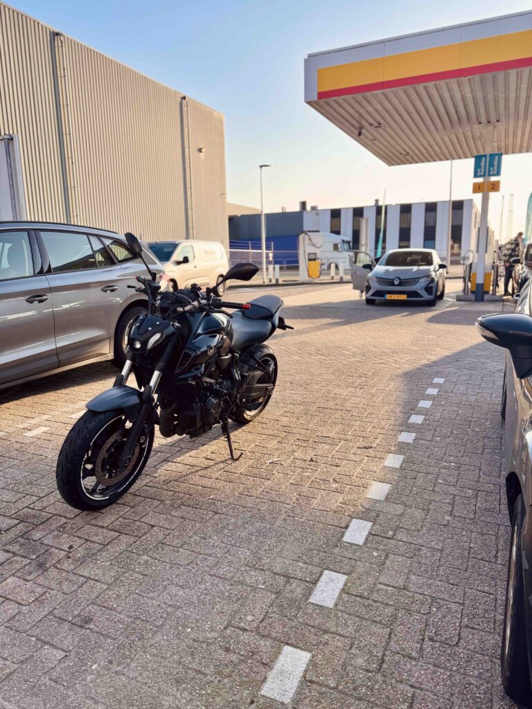 Example of multilane positioning for motorcycle with cars around demonstrated in a safe environment.