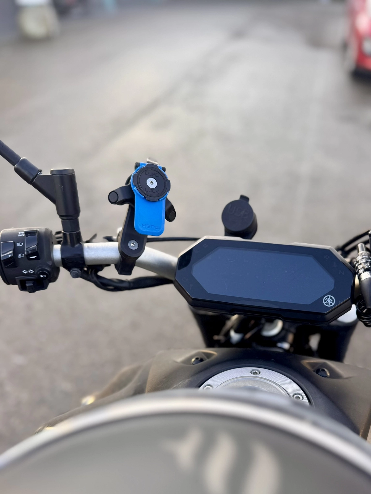 Quad Lock phone mount installed on the handlebar of a Yamaha MT-07
