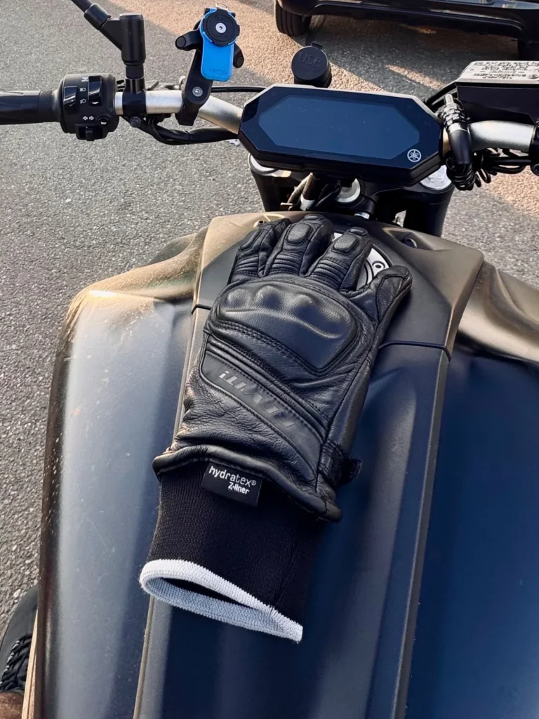 Single REV’IT Boxxer 2 H2O winter motorcycle glove placed on a Yamaha MT-07 tank
