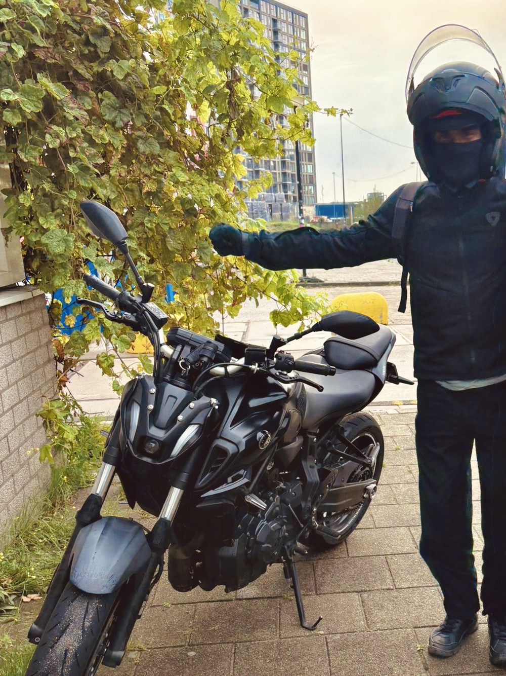 Rider enjoying his moment after a ride on a yamaha mt07