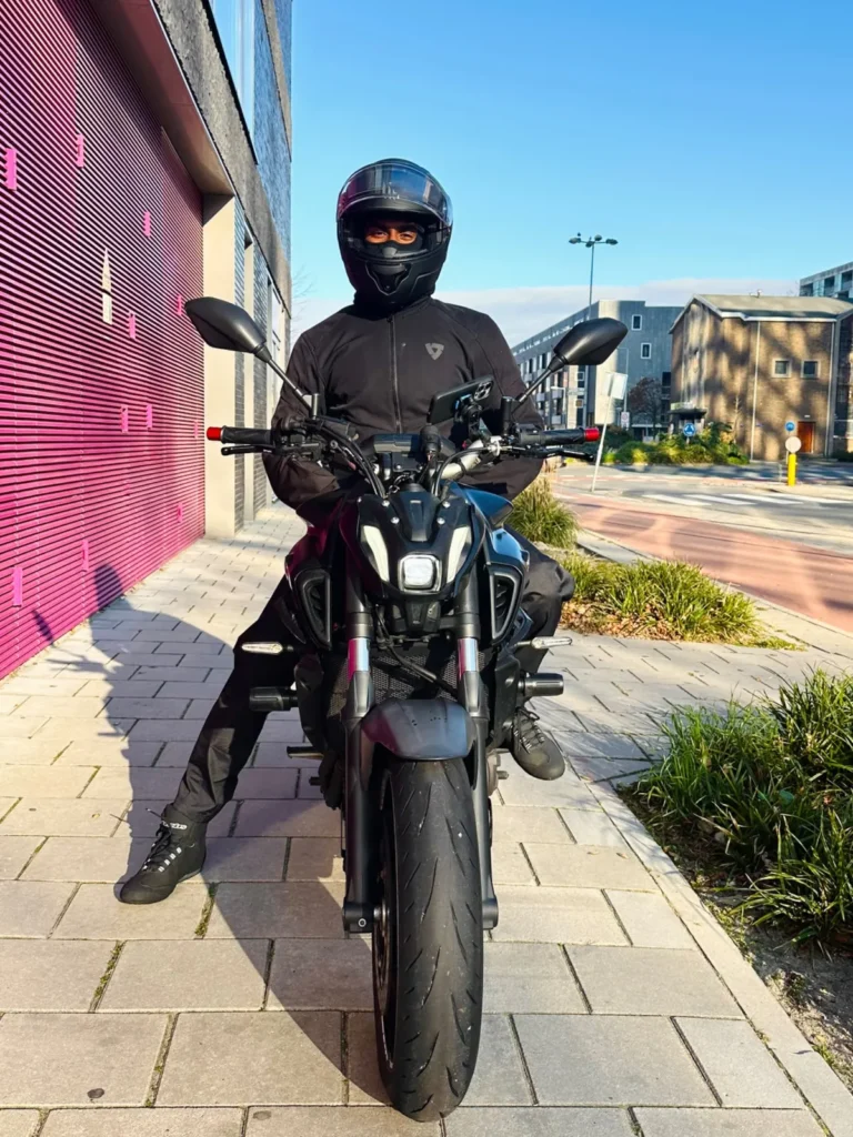 Rider sitting on a Yamaha MT-07 on a city sidewalk for bymrjohnson about page