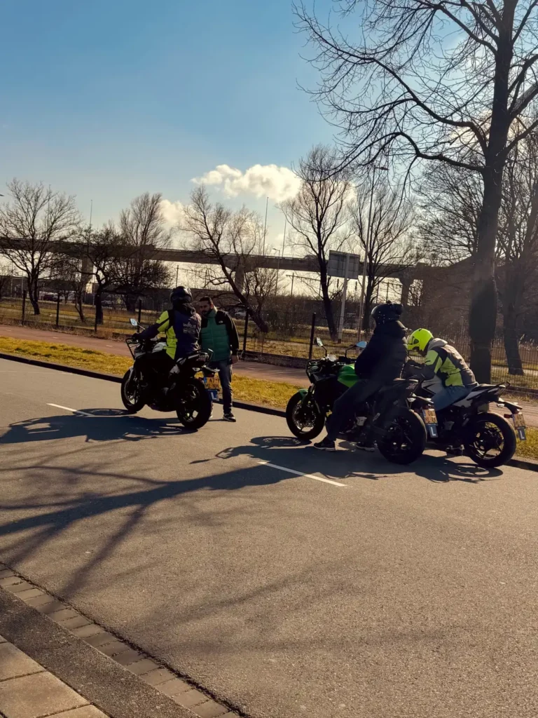 Motorcycle students and instructor stopped on the roadside during a training session