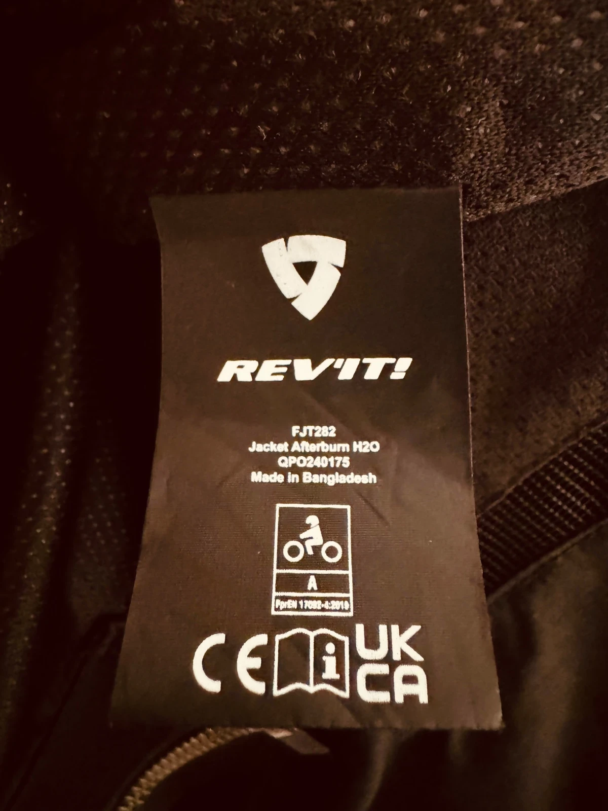 CE certification label inside a Rev’It motorcycle jacket