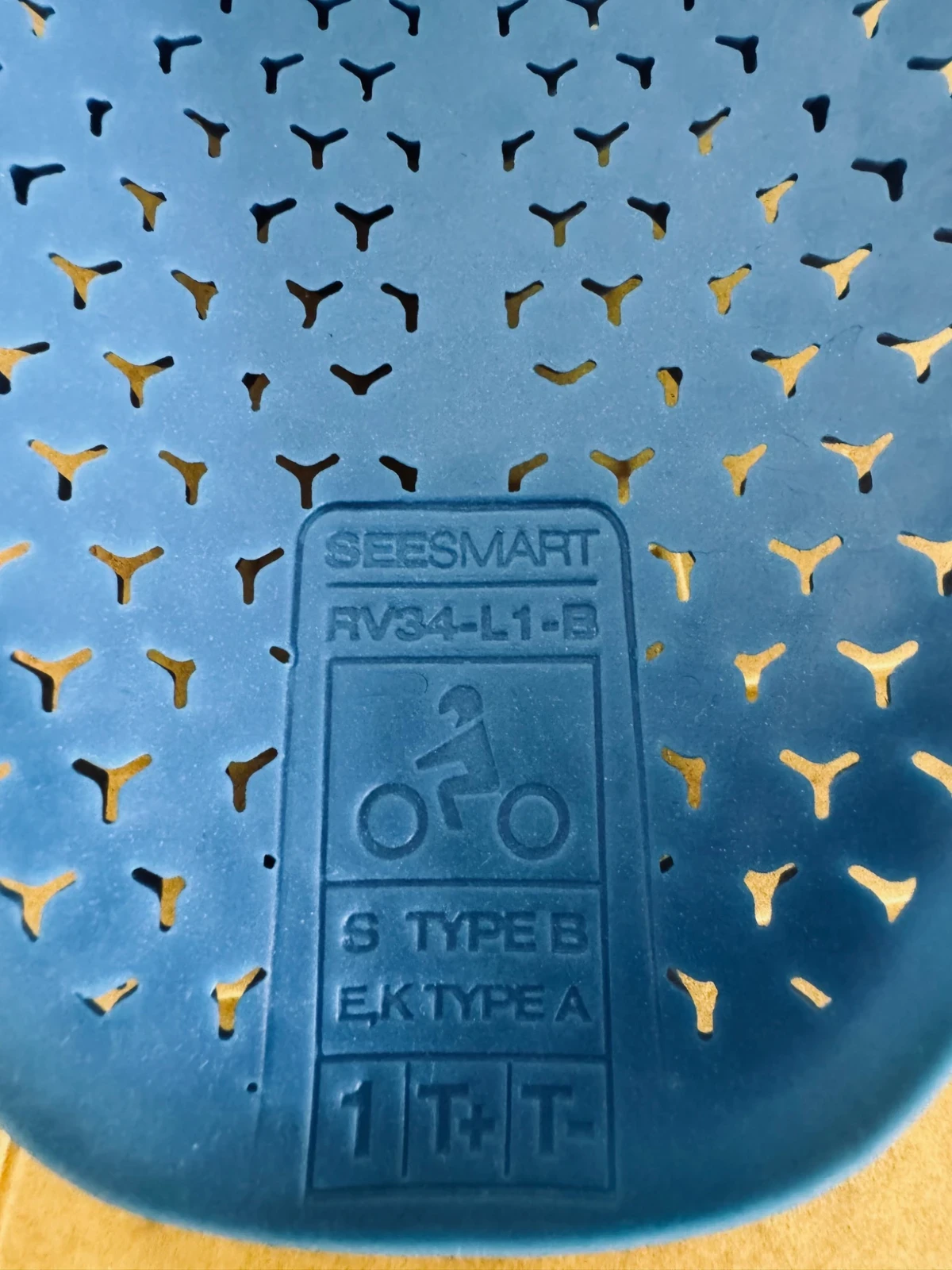 Close-up of blue SEESMART motorcycle armor showing protection type and rating details