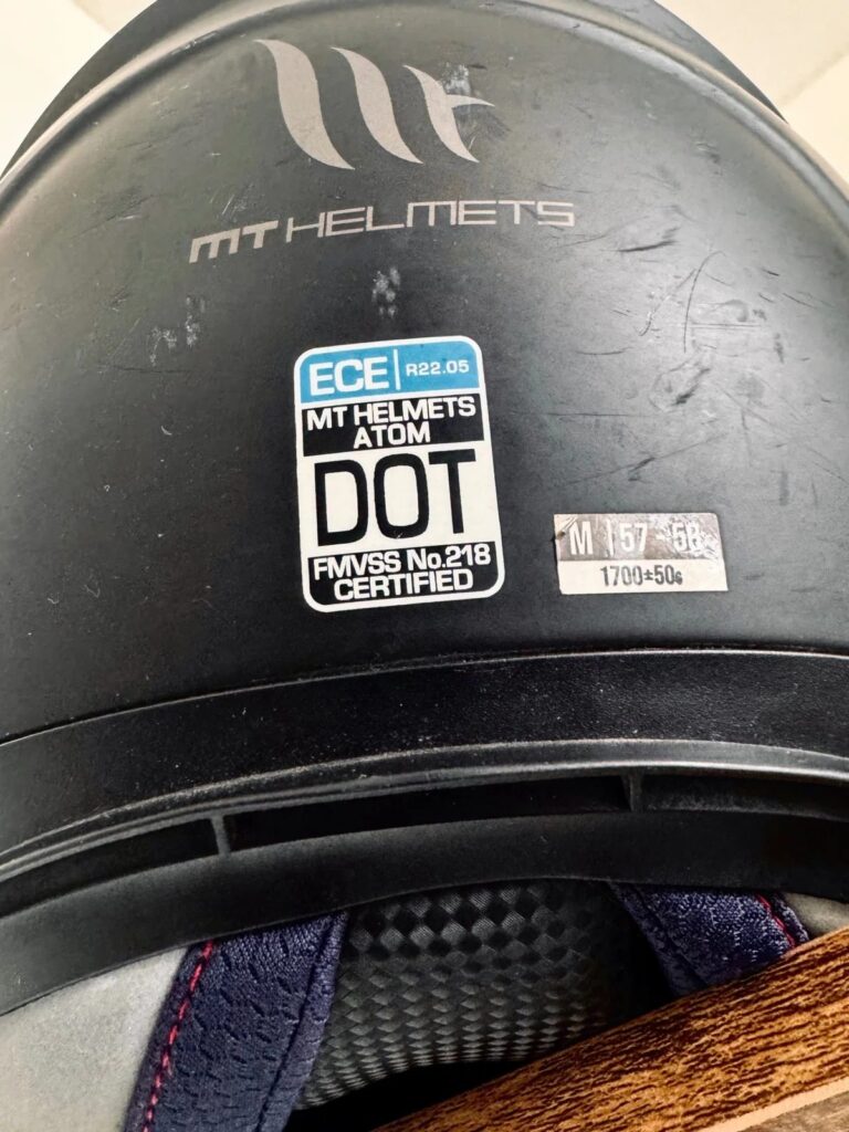 ECE 22.05 motorcycle helmet approval label showing helmet safety standard