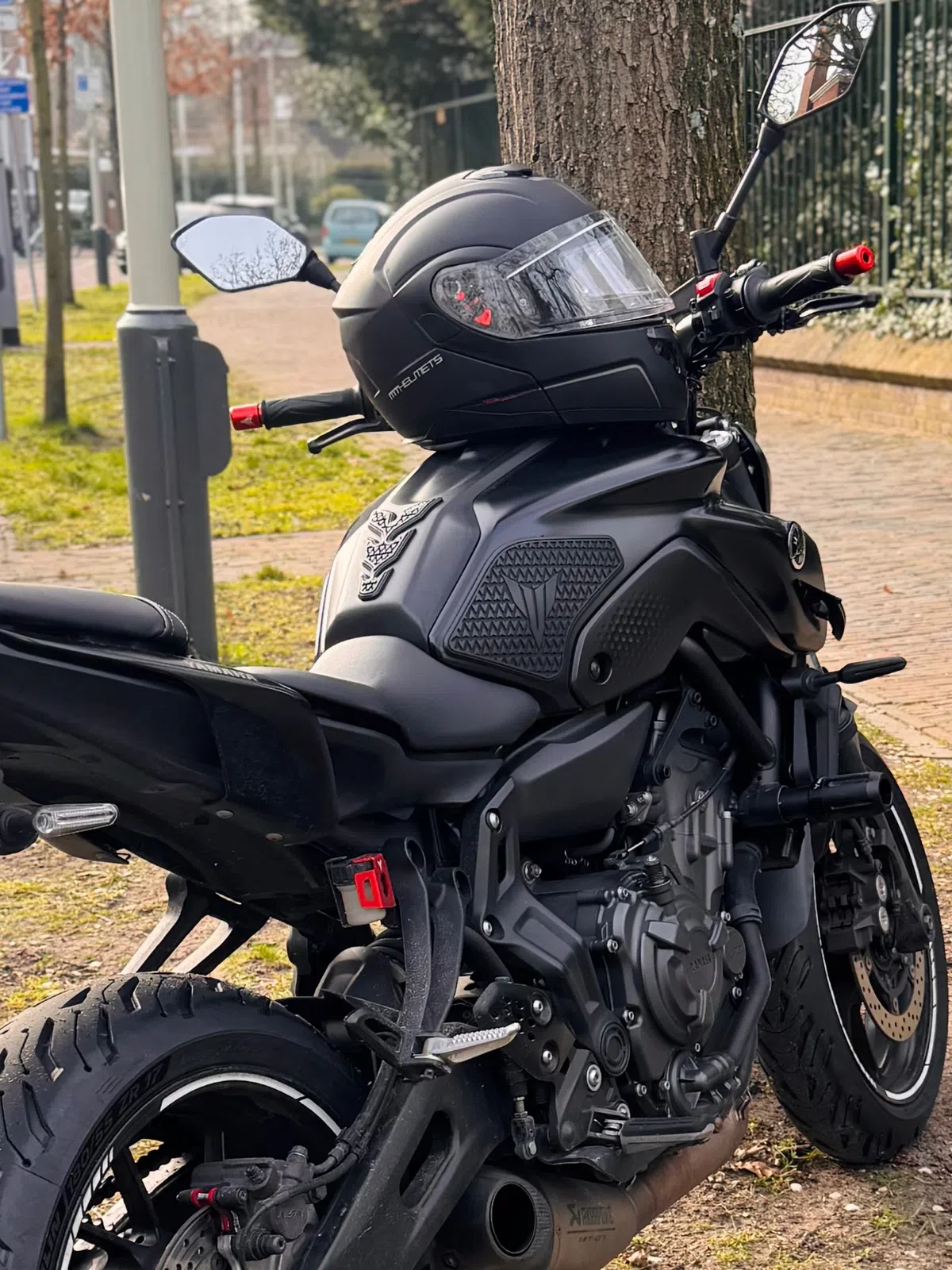 MT modular helmet resting on a Yamaha MT-07 motorcycle