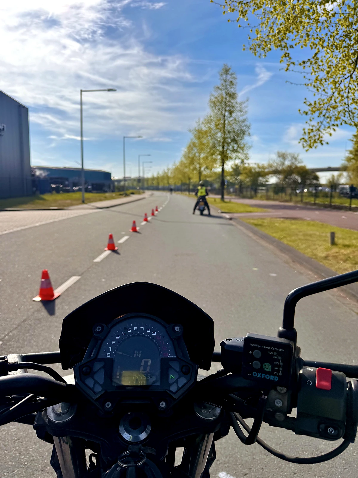 Motorcycle rider view of a beginner cone slalom drill for balance control