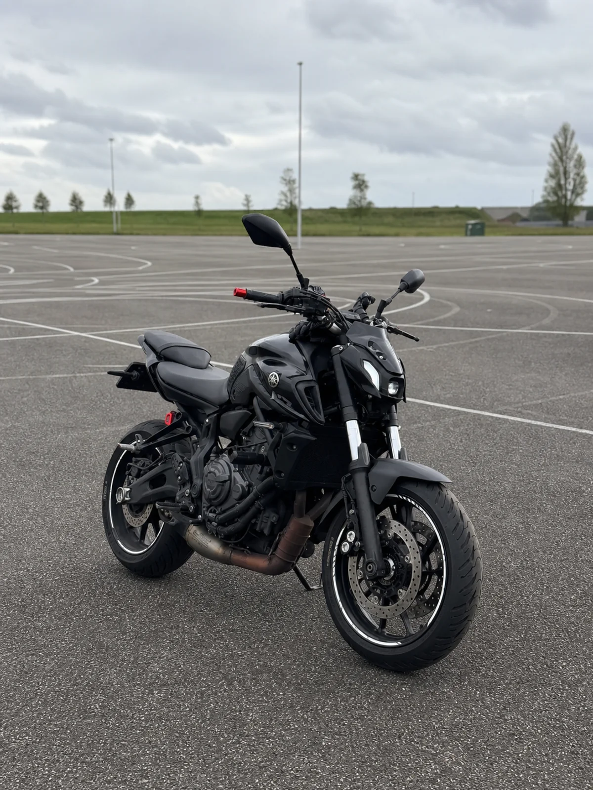 Yamaha MT-07 in an empty parking lot for low-speed control practice