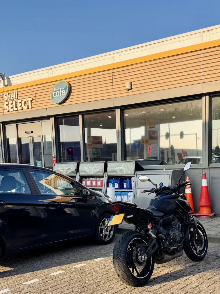 Yamaha MT-07 parked outside a Shell cafe during a motorcycle fuel stop