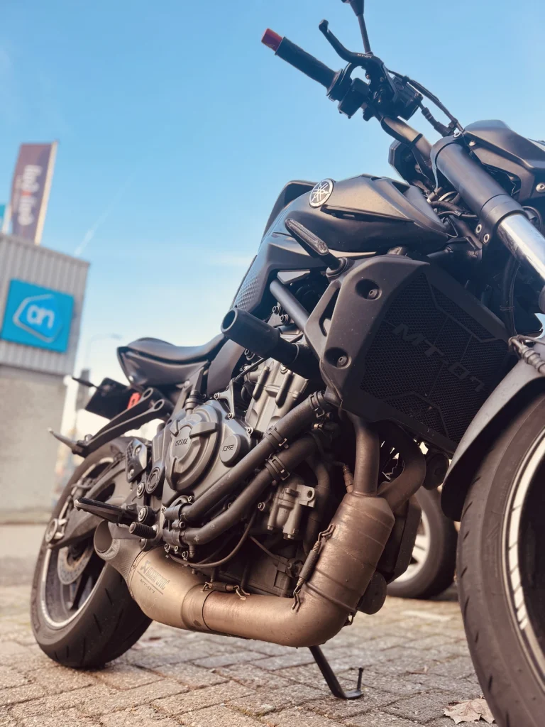 Close-up of a Yamaha MT-07 engine, tank and frame showing practical ownership details